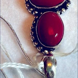 Red coral three stone pendant set in 925 sterling
